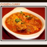 Chicken Curry · Boneless chicken pieces cooked with curry spices.