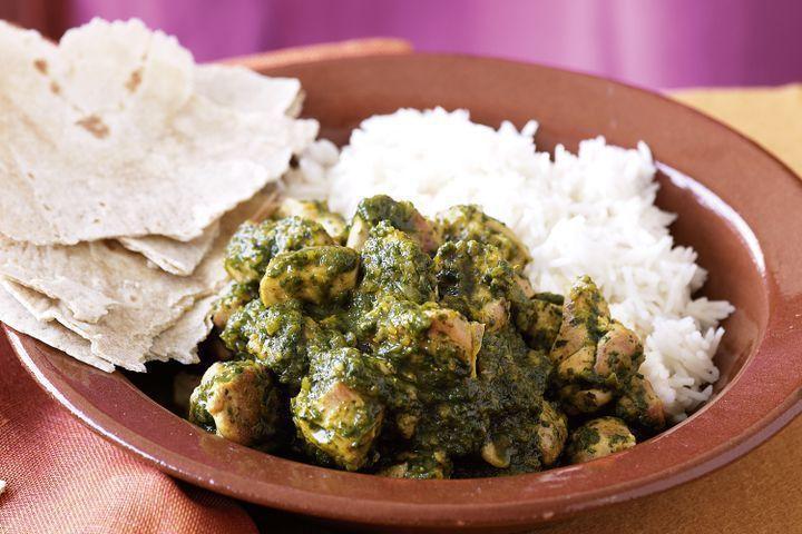 Chicken Saag · Tender pieces of chicken cooked with creamed spinach and blended with herbs.