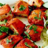 Chicken Tikka · Tender boneless chicken gently flavored with spices and barbecued on a skewer. Served hot.