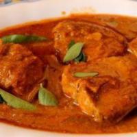 Fish Curry · Fish prepared with fresh onions, tomatoes, garlic and cloves in a special sauce.