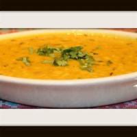 Jhane Ko Dhal · A local style of boiled lentils sauteed in vegetables and cumin seeds, ginger, garlic, tomat...