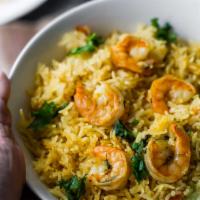 Shrimp Biryani · Basmati rice cooked with succulent pieces of prawn, nuts and Nepalese spices.