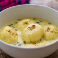 Ras Malai · Patties of fresh homemade cheese and sweetened milk served cold with pistachios.