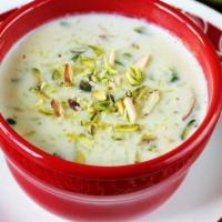 Kheer · Traditional Indian rice pudding made with raisins and nuts.