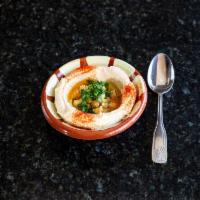 Hummus · Fresh smashed chickpeas blended with tahini sauce, lemon, and garlic topped with olive oil a...