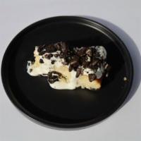 Oreo Cheesecake · Oreo cookie topping over creamy cheesecake.