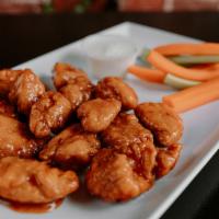 Boneless Chicken Wings · Just like the Bone-In Wings, but without the bones! All natural chicken breaded and tossed i...