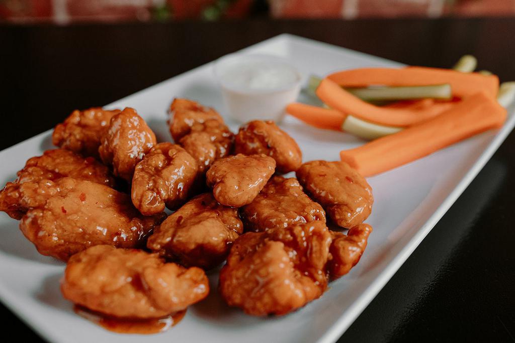 Boneless Chicken Wings · Just like the Bone-In Wings, but without the bones! All natural chicken breaded and tossed in your favorite wing sauce. 