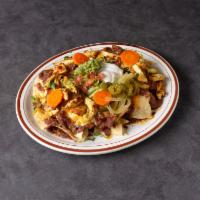 Chef Nachos · Crispy corn chips covered with beans, and melted cheese topped guacamole, pico de gallo, sou...