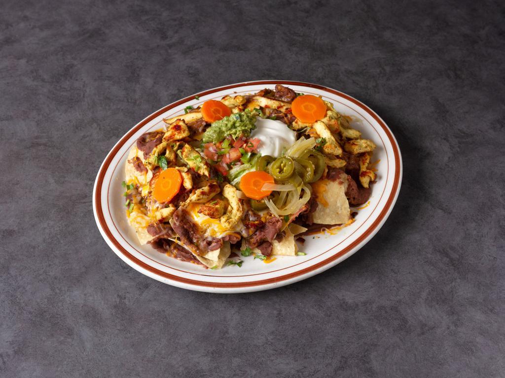 Chef Nachos · Crispy corn chips covered with beans, and melted cheese topped guacamole, pico de gallo, sour cream and jalapenos.