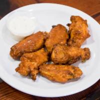 Classic Wings · Classic bone in wings are tossed in flavorful sauces.