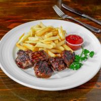 Steak Tips with Fries · BBQ steak tips with french fries.