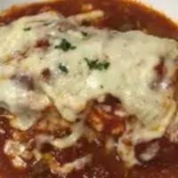 Meat Lasagna · Homemade pasta layered with ricotta, mozzarella, romano, ground beef, and marinara sauce. Ba...