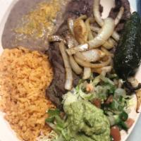 Carne Asada Plate · Includes beans, rice, guacamole, pico de gallo, and tortillas.