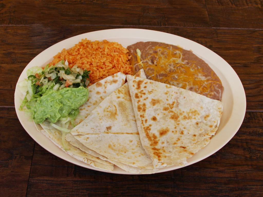 Quesadilla · Your choice of pork, asada, chicken, or shredded beef with rice, beans, lettuce, guacamole, and pico de gallo.