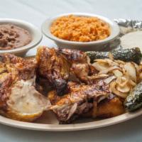 Whole Chicken · The whole Grilled Chicken includes a side of beans, rice, grilled onions with jalapeños, and...