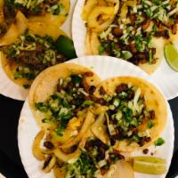 Street Taco · Steak, marinated pork, shredded beef, carnitas or chicken. Topped with onion and cilantro