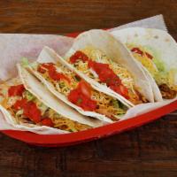 Soft Taco · Flour tortilla with your choice of meat. Topped with lettuce, cheese, and mild salsa.