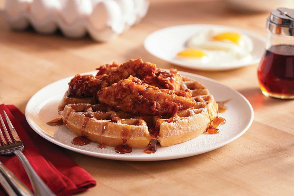 Chicken and Waffles · Freshly made Belgian waffle served with hand-breaded chicken tenders, sprinkled with powdered sugar and served with butter, syrup and hot sauce.