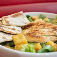Chicken Caesar Salad · Grilled marinated chicken breast with romaine lettuce, home-style croutons, shredded Parmesa...