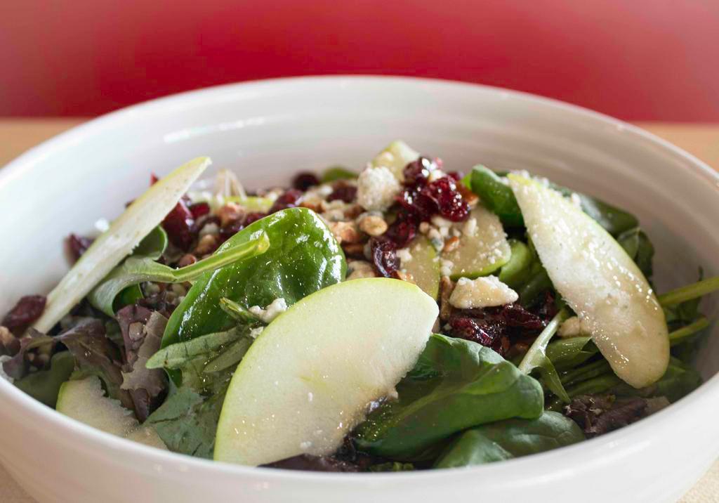 Michigan Apple Salad · Spring greens, apples, dried cranberries, toasted pecans and bleu cheese crumbles with apple cider vinaigrette.