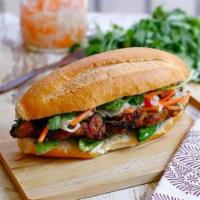 Grilled Pork Sandwich · The inside is stuffed with meat, mayonnaise, carrots, daikon, cucumbers, jalapeno and topped...