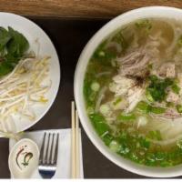 Chicken Pho Noodle Soup · Pho ga. consists of soft slippery pho noodles, sliced chicken meat and light and fragrant br...