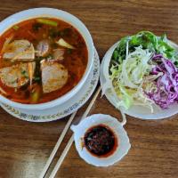 Spicy Beef Noodle Soup · Bun bo hue. a spicy central Vietnamese beef soup with lemongrass flavor. Thick rice noodles,...
