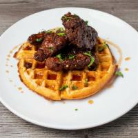 Bird in the Bed · Sourthern fried chicken on a Belgian waffle covered with spicy maple syrup.