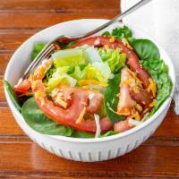 House Salad · Fresh Romaine mixed with fresh Baby spinach vine ripe tomatoes with shredded cheddar and moz...