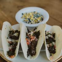 Tacos  · 3 corn or flour tortillas, choice of protein, grilled red onions, cilantro, cotija cheese, s...