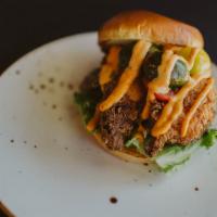 Fried Chicken Sandwich · Fried chicken with dill pickles, lettuce, marinated tomatoes, red pepper aioli on a brioche ...