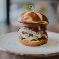Red Top Burger · Cooked well. Two 4 oz. patties, cheddar, pickles, thick-cut bacon harissa mayo, brewer's mus...
