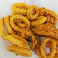 Fried Calamari 8 oz · Lightly breaded with our house made breading mix and served with sweet and chili sauce.