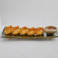 Crab Rangoon  · Imitation crab meat mixed with cream cheese and celery wrapped in a wonton skin.