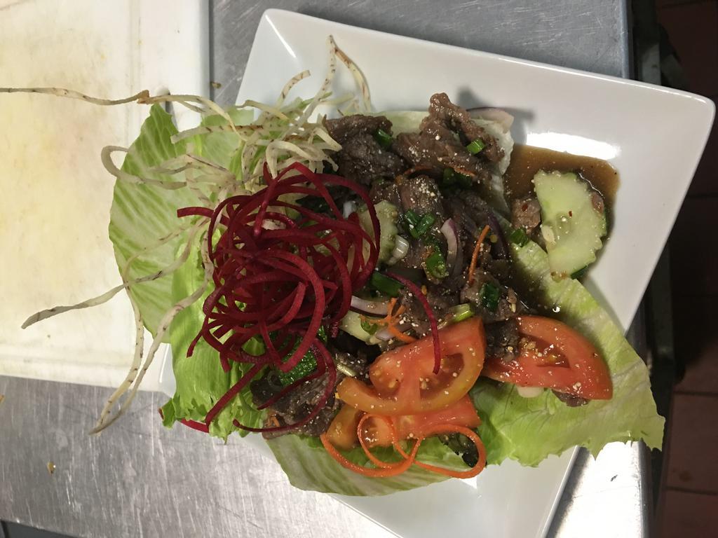 Grilled Beef Salad · Marinated grilled beef, cucumber, scallion,cilantro, mint, shallot in chili lime dressing