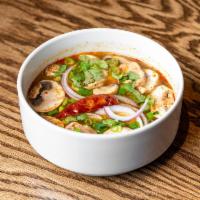 Tom Yum Soup · Bright, signature, in a spicy Thai herb broth. Choice of chicken, shrimp, tofu, or vegetables.