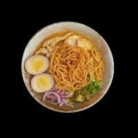 Kao Soi Ramen · Ramen noodle in Thai curry northern style on top with chicken, boiled egg, scallion, red oni...