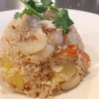Pineapple Fried Rice · With egg, pineapple, onion, cashew nut, tomato, and scallions.