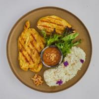 Chicken Turmeric · Grilled marinated chicken breast with turmeric, lemongrass and Thai herbs. Served with cocon...