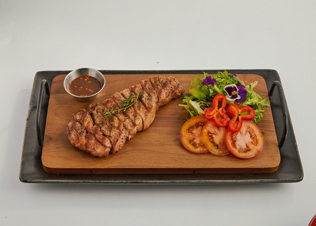 Tiger Cry Steak · Grilled Sirloin Steak with spicy chili tamarind sauce (jim jiaw), with sides and rice.