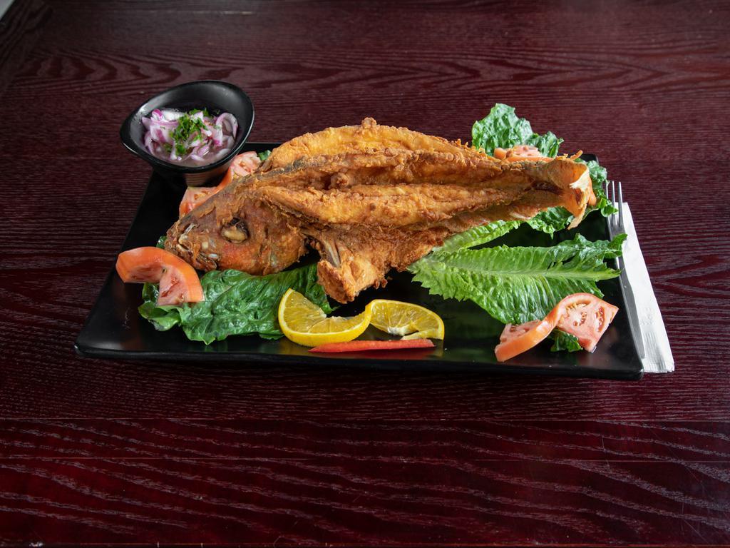 Pargo Frito · Fried red snapper with choice of 1 side.