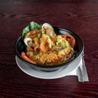 Arroz con Mariscos · Barzola's seafood mix includes crab meat, scallops, green clams, peeled clams, tuna, shrimp,...