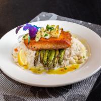 Pan Seared Salmon · Served with cilantro lime rice, asparagus, curry lump crab sauce.