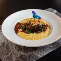 Braised Beef Short Ribs · Served with creamy polenta-ribs braised for 8 hours in red wine, creamy cheddar polenta, fri...
