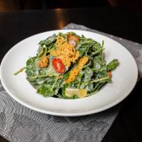 Caesar Salad · Baby kale Caesar salad with cheese crisp and croutons.