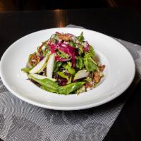 Signature Apple Cranberry Salad · Mixed greens, blue cheese, candied walnuts, pickled onions, and raspberry vinaigrette.