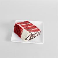 Red Velvet Cake · Brilliant red velvet cake layers, stacked four high, are spread with deep chocolate truffle ...