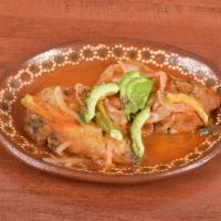 Chiles Rellenos · Roasted Pueblan peppers stuffed with fresh cheese in a tomato sauce.