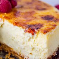 Creme Brulee Cheesecake Slice with Whip Cream · Calling all cheesecake fans! This creme brulee cheesecake is super creamy, super thick and s...